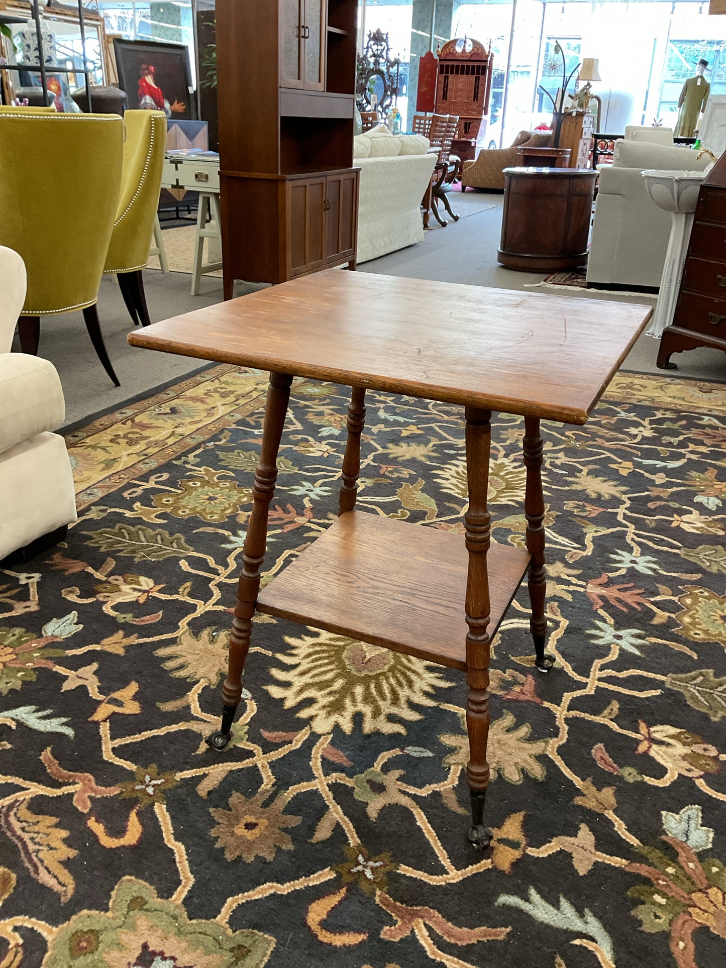Tall Side Table with Claw Feet Holding Clear Glass Marbles
